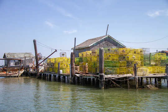 Crab pots on a dock in Chesapeake Bay, Va.  (how to get abandoned lost and discarded ghost fishing gear out of the ocean)