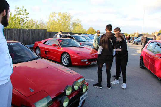 Modified cars parked in carpark.