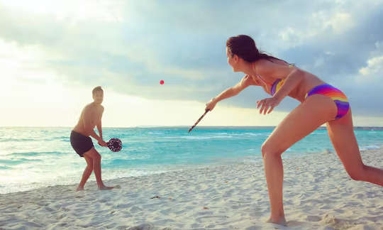 couple playing on a beach