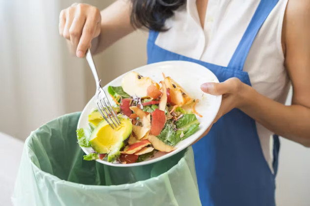 Image of fresh vegetables in a kitchen, illustrating tips for reducing food waste at home by planning meals and using leftovers effectively.