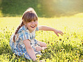 radiant young girl in an equally radiant meadow