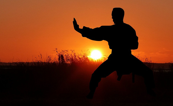 a person practicing a meditative form of martial arts