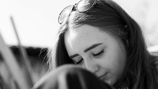 woman with eyes closed in reflection