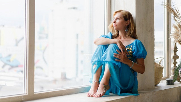 woman sitting by a window