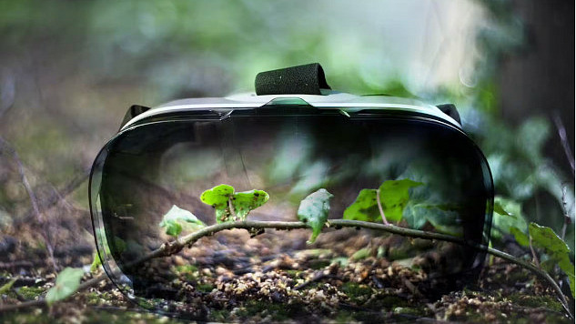 A VR headset with sprouting green leaves reflected on its surface represents the debate on whether virtual nature can provide the same wellness benefits as real nature.