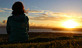 woman sitting outside peacefully