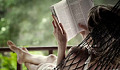 woman sitting back relaxing in a hammock