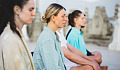 women sitting in meditation