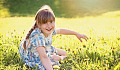 radiant young girl in an equally radiant meadow