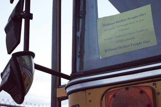 A sign in a school bus parked in one of Seattle’s southern industrial zones. 