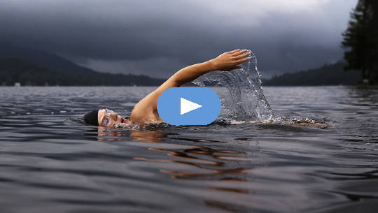 a swimmer in large expanse of water