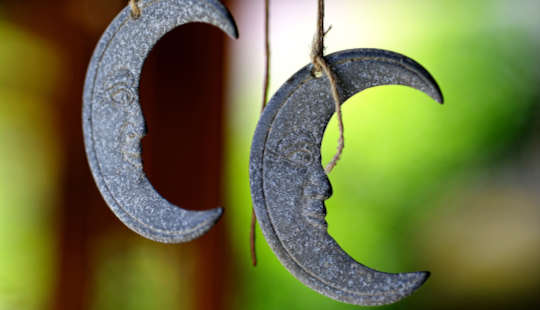 metal crescent moon hanging on a string