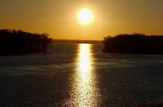 sun shining over the calm waters