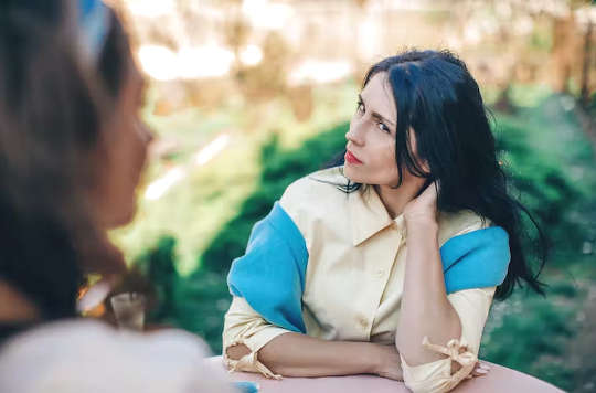 two people sitting down having a conversation