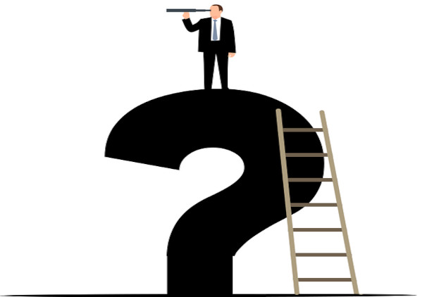 man using a telescope standing on top of a question mark 