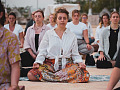 a group of women sitting together and meditating