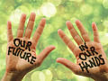 photo of two open hands with the words painted on them: Our Future in Our Hands