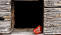 a picture of a heart in a dark door opening