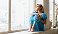 woman sitting by a window