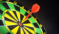 a dart right in the bull's eye of a dartboard