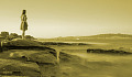 young girl looking over a desolate monochromatic landscape